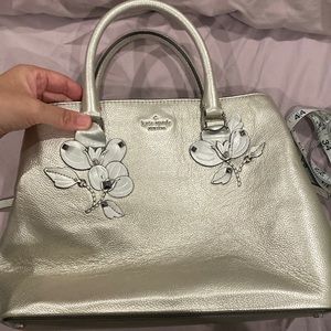 NWOT Kate Spade gold tone purse with flower decal gunmetal/silver hardware